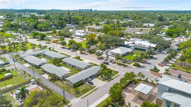 an aerial view of residential houses with outdoor space