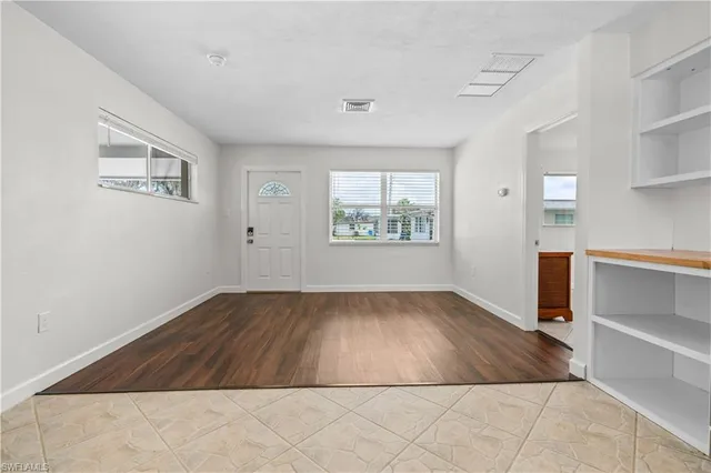 an empty room with windows