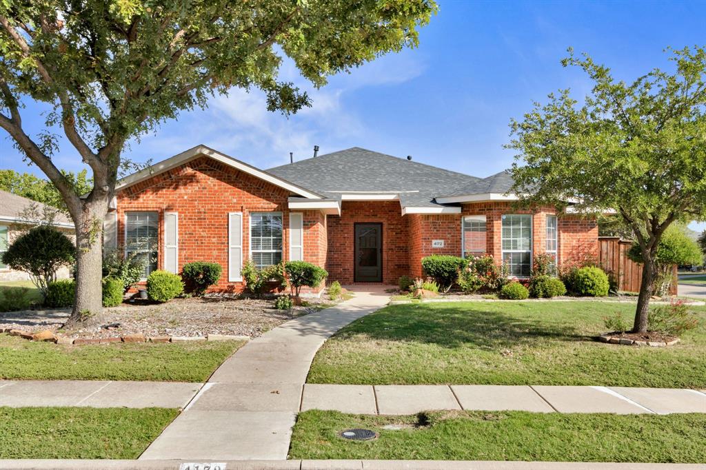 4172 Freedom Lane Frisco, TX 75033 - Photo 1 of 28 a front view of a house with a yard