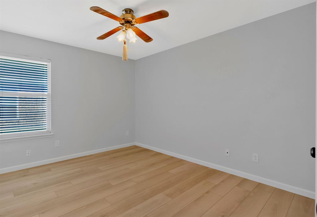 4172 Freedom Lane Frisco, TX 75033 - Photo 21 of 28 an empty room with a window and a fan