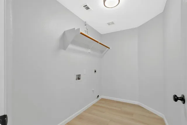 a view of a room with white walls