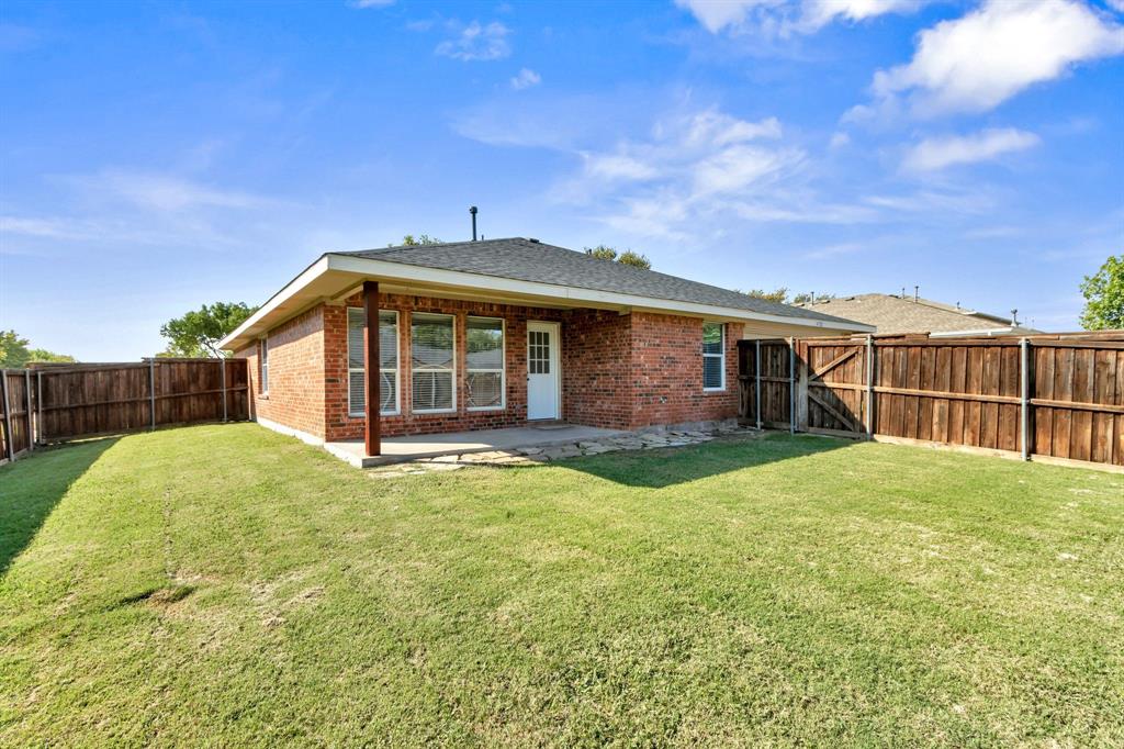 4172 Freedom Lane Frisco, TX 75033 - Photo 25 of 28 a view of a house with backyard and garden