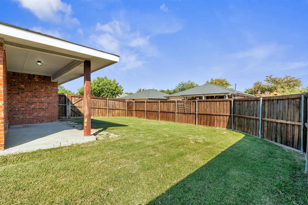 4172 Freedom Lane Frisco, TX 75033 - Photo 28 of 28 a view of backyard with wooden fence