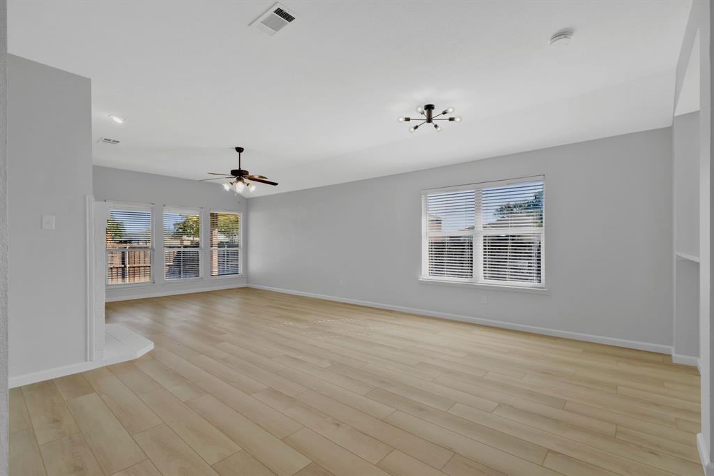 4172 Freedom Lane Frisco, TX 75033 - Photo 4 of 28 a view of a livingroom with a ceiling fan window and hardwood floor