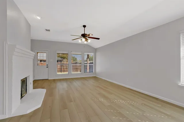 a view of livingroom with hardwood floor and ceiling fan