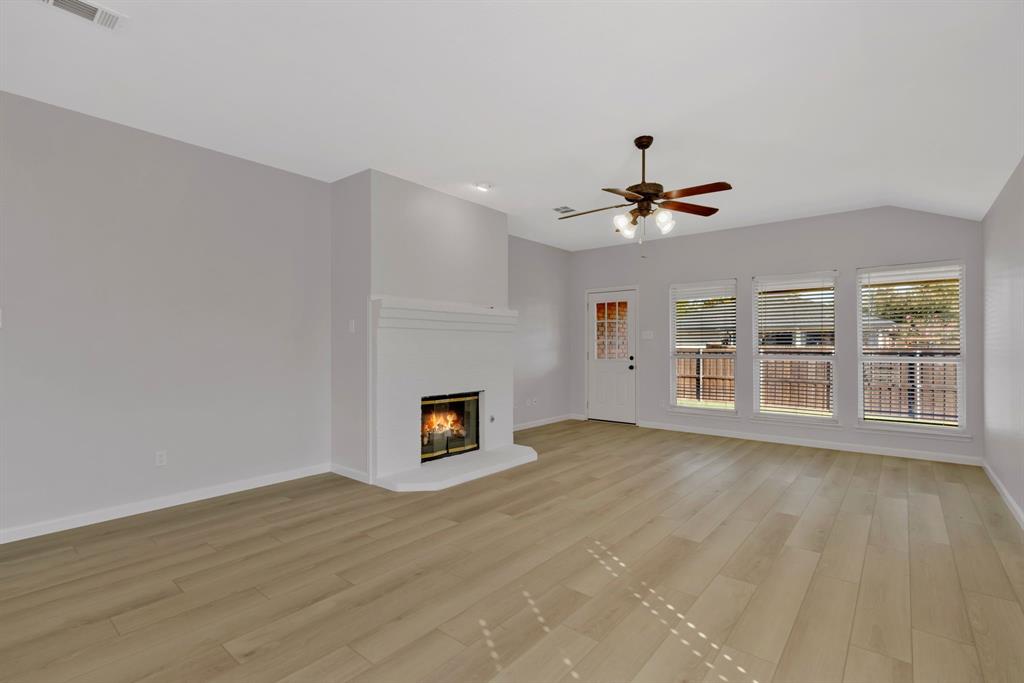 4172 Freedom Lane Frisco, TX 75033 - Photo 6 of 28 a view of an empty room with a window and a kitchen
