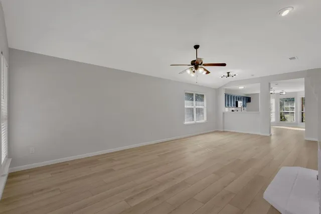 a view of an empty room with a window