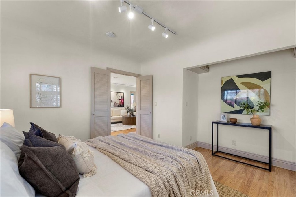 243 Park Avenue Long Beach, CA 90803 - Photo 13 of 52 a bedroom with a bed and a dresser