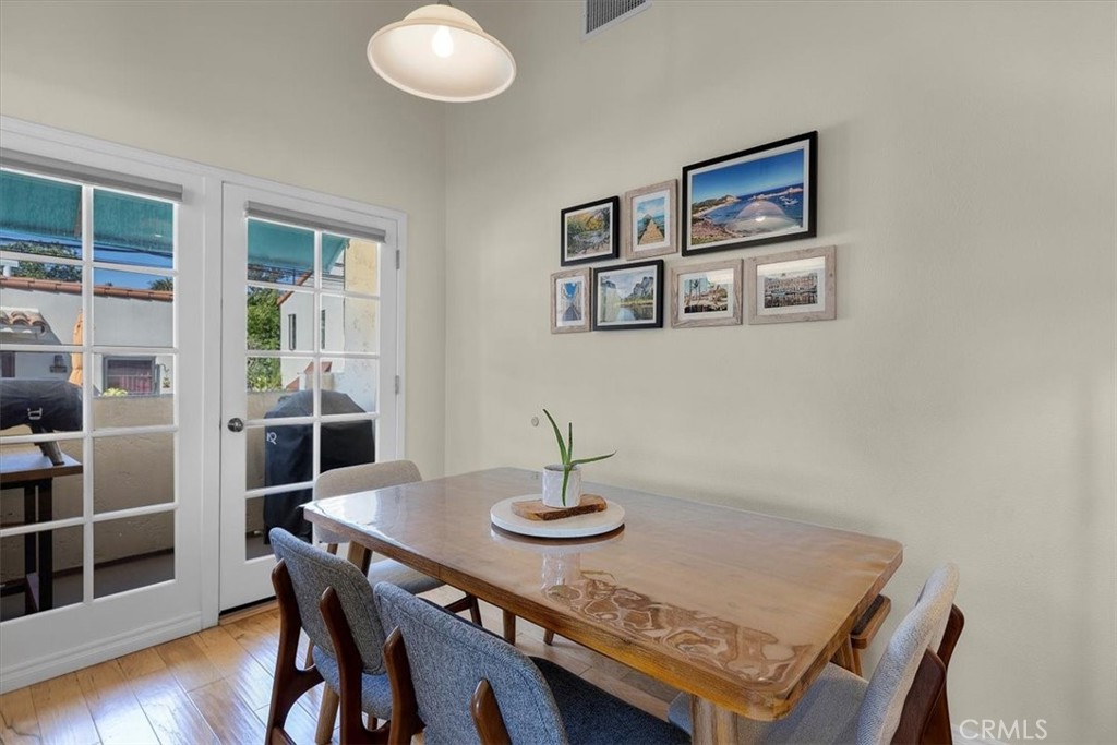 243 Park Avenue Long Beach, CA 90803 - Photo 32 of 52 a view of a dining room with furniture and wooden floor