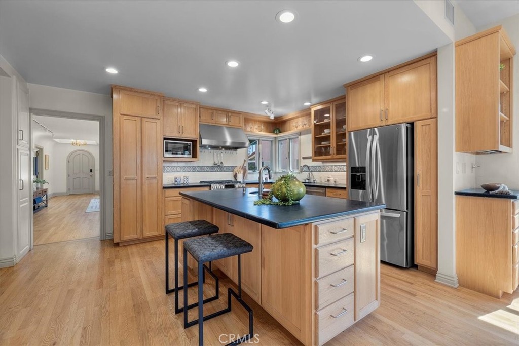 243 Park Avenue Long Beach, CA 90803 - Photo 5 of 52 a kitchen with stainless steel appliances a refrigerator and a stove top oven