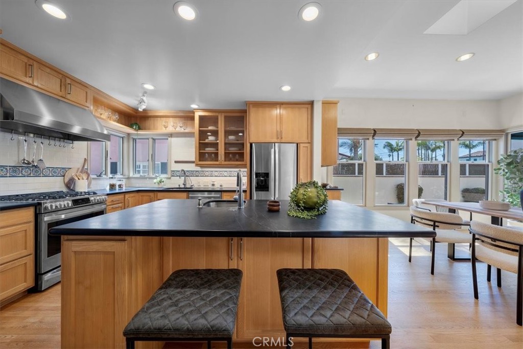 243 Park Avenue Long Beach, CA 90803 - Photo 8 of 52 a view of kitchen island with stainless steel appliances granite countertop living room and living room view