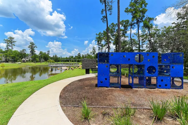 a front view of a house with swimming pool having outdoor seating