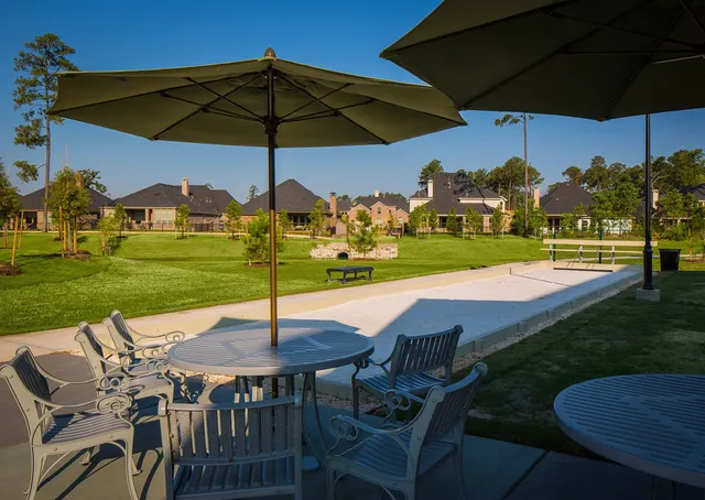 a view of a swimming pool with a yard