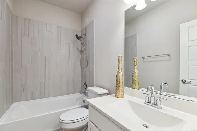 a bathroom with a sink a toilet and a bathtub