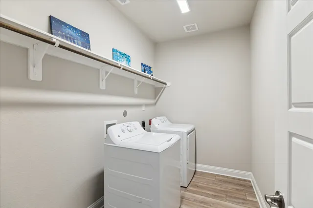 a utility room with dryer and washer