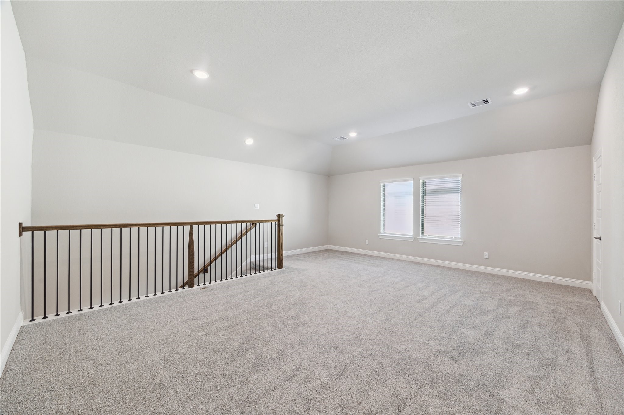 17108 Coneflower Place Conroe, TX 77385 - Photo 10 of 27 Walking up to the upstairs game/living room.