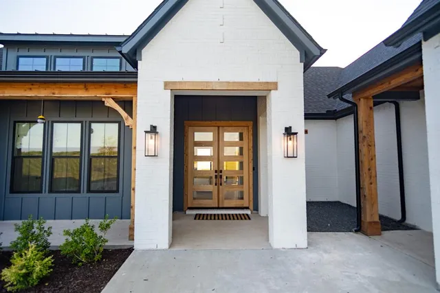a view of a house with wooden walls