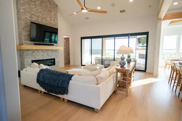 a living room with furniture fireplace and a flat screen tv