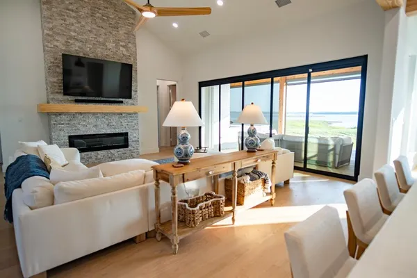 a living room with furniture fireplace and a flat screen tv