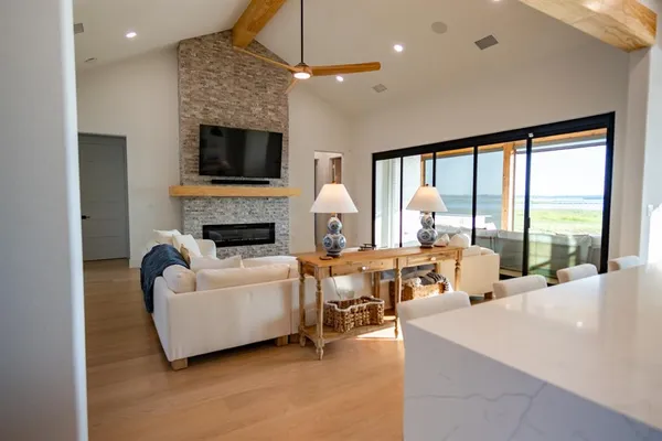 a living room with furniture fireplace and a flat screen tv