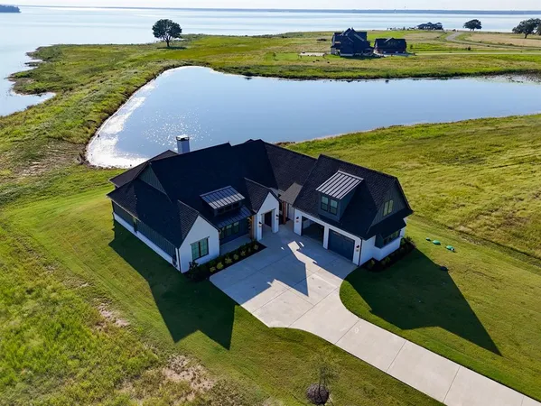 a aerial view of a house with a yard