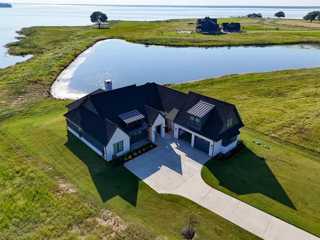 a aerial view of a house with a yard