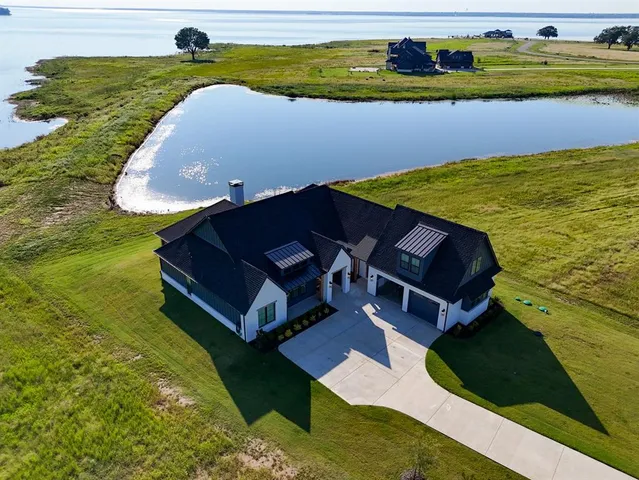 a view of a swimming pool with a yard