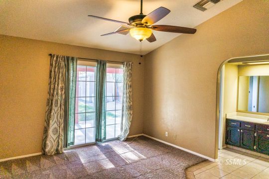 512 Amanda Street Ridgecrest, CA 93555 - Photo 30 of 44 an empty room with windows and fan