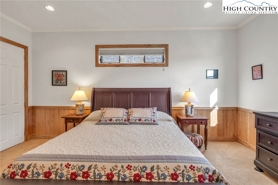 933 Thunder Ridge Lane Lenoir, NC 28645 - Photo 36 of 45 a bedroom with a bed and a table