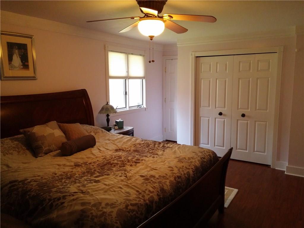 390 Richard Road Wexford, PA 15090 - Photo 12 of 21 Master bedroom with newer hardwood flooring, ceiling fan, closet organizers and master bath