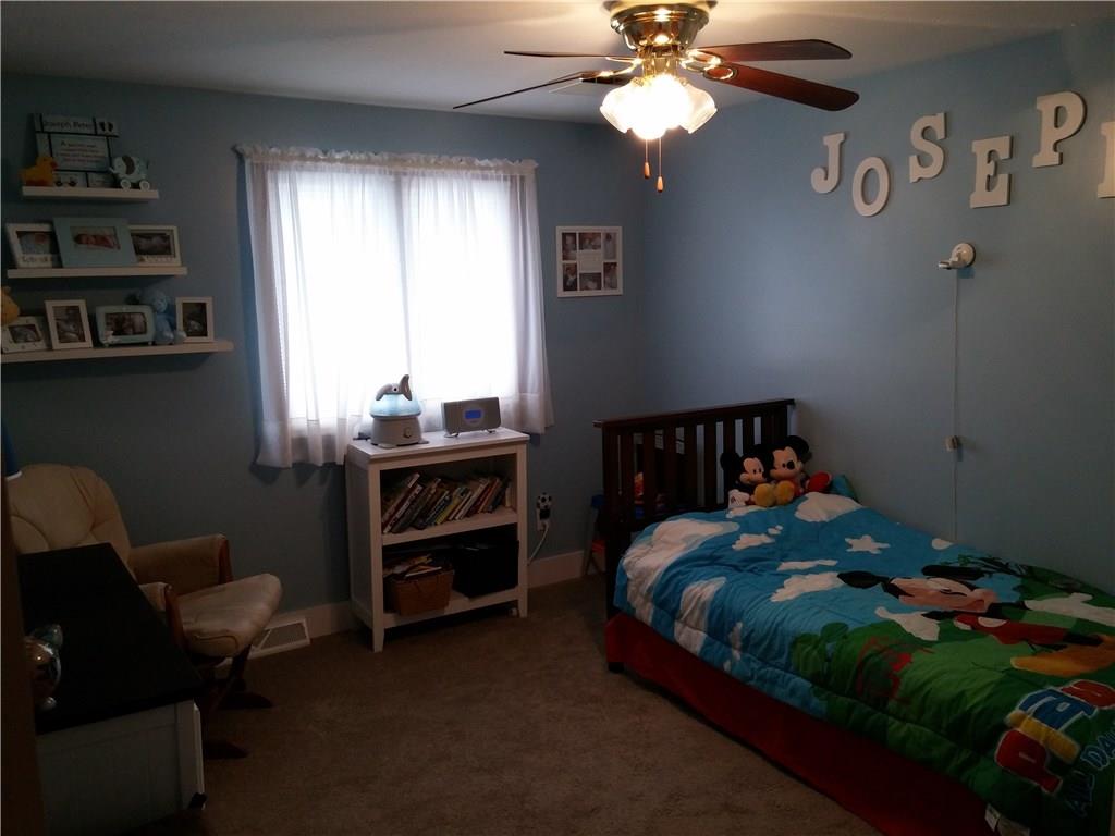 390 Richard Road Wexford, PA 15090 - Photo 14 of 21 3rd upstairs bedroom has wall-wall carpeting, ceiling fan and closet organizers