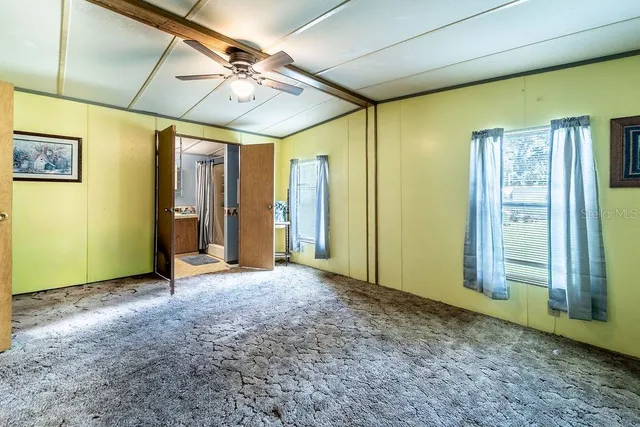 a view of hallway with livingroom and furniture