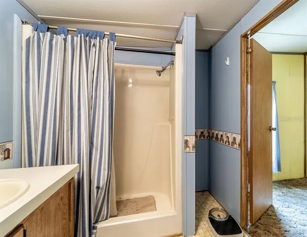 a bathroom with a sink a toilet and bathtub