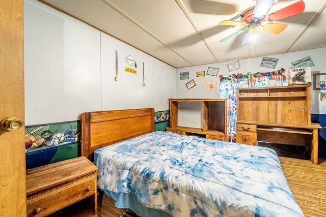 a bedroom with a bed and a dresser