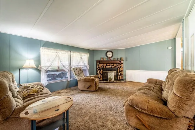 a dining room with furniture and window