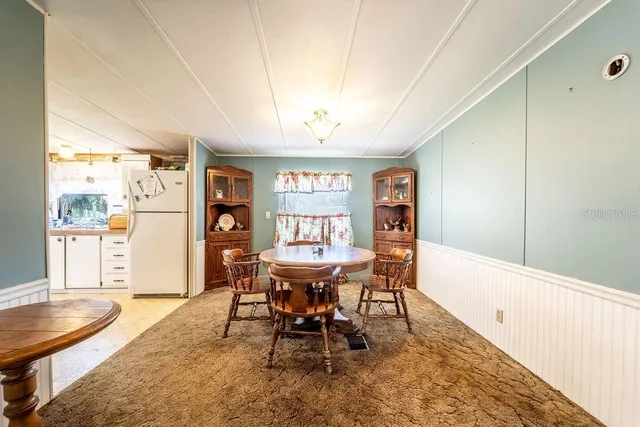 a indoor dining space with furniture and wooden floor