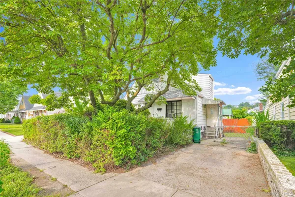 a view of a house with a tree