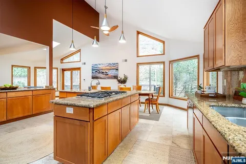 a view of a dining room with furniture and a window