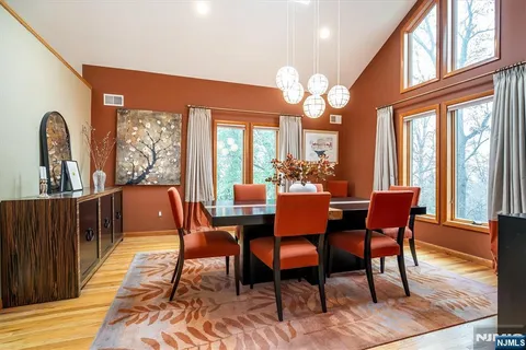 a bedroom with furniture and wooden floor