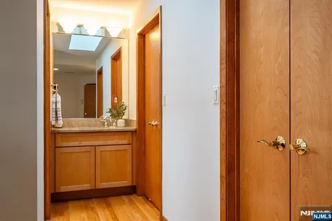 a bathroom with a sink double vanity and a mirror