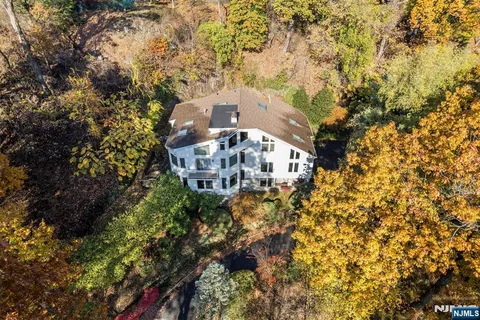 a view of a house with a tree