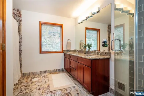 a view of staircase with wooden floor and a window