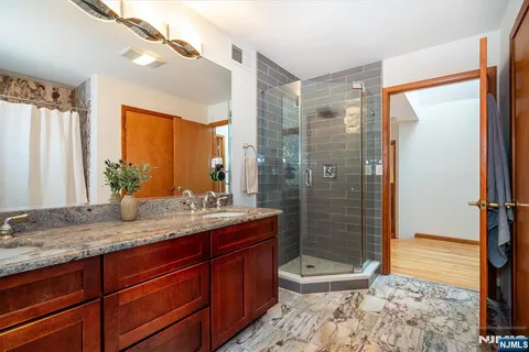 a living room with furniture a rug and a window