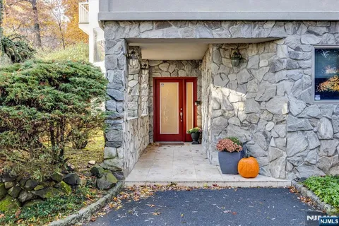 a view of a house with a yard and deck