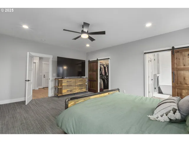 a bathroom with a tub a double vanity sink double and mirror