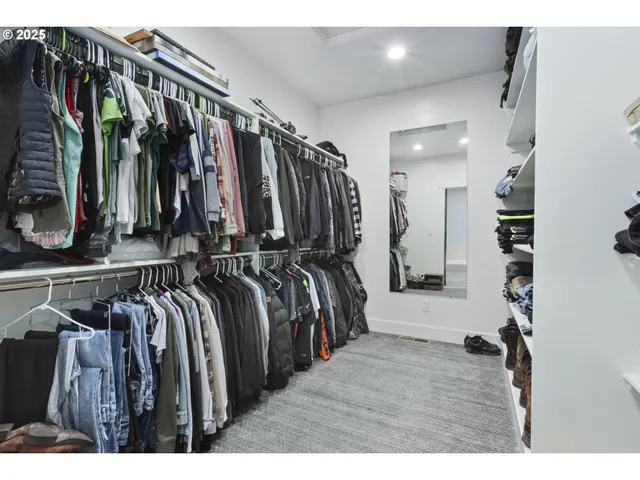 a bathroom with a shower a sink and a mirror