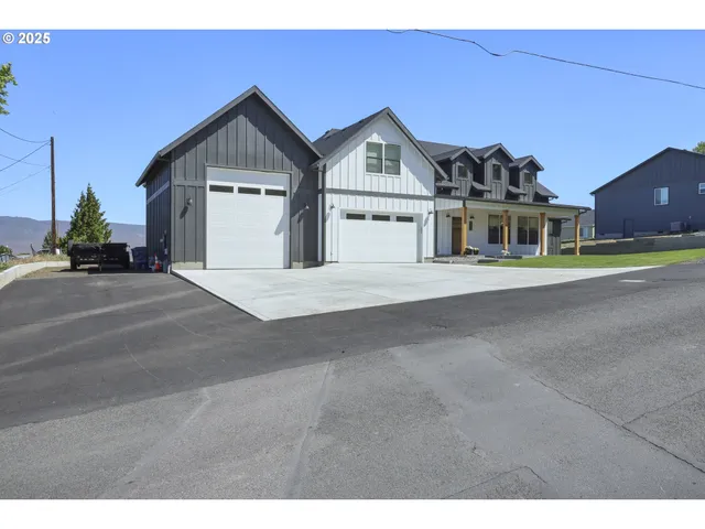 a view of a house with a street