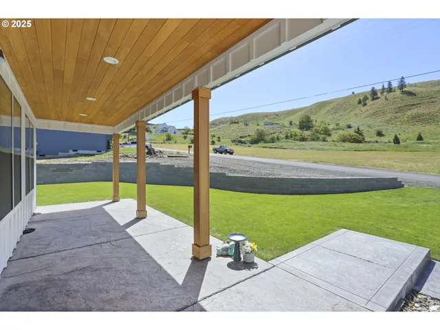an aerial view of a house with a garden and plants