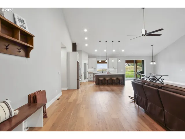 a living room with furniture wooden floor and a fireplace