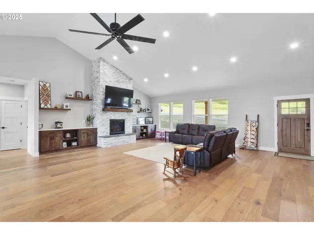 a living room with lots of furniture and kitchen view